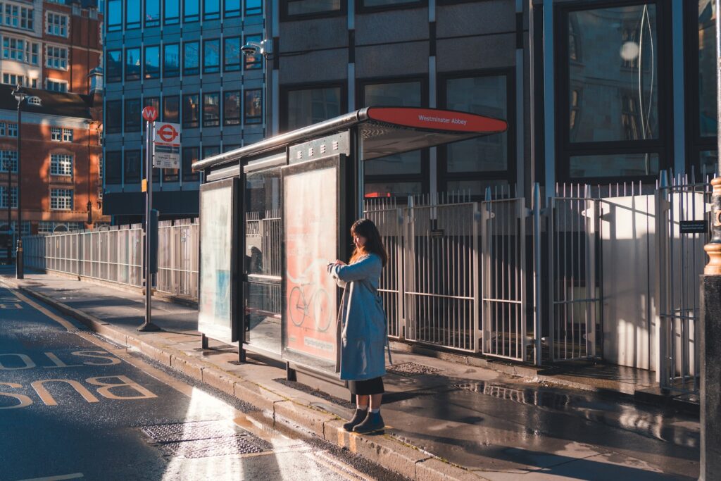 woman in white dress standing near building during daytime