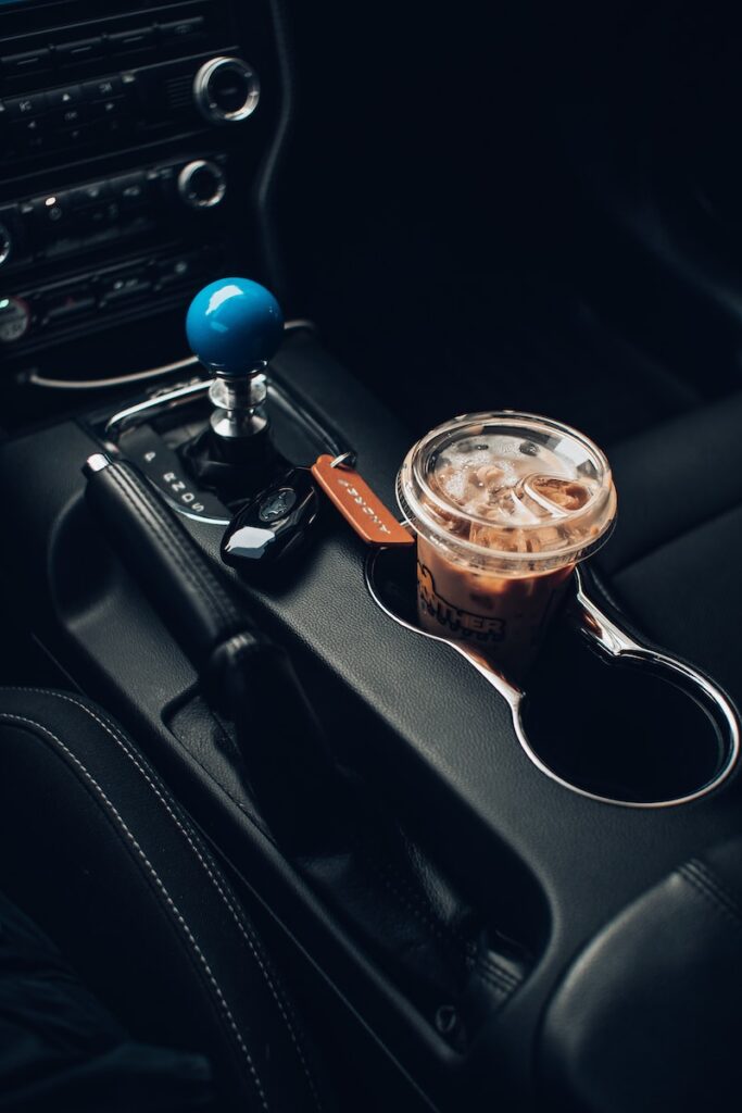 clear glass cup with brown liquid inside