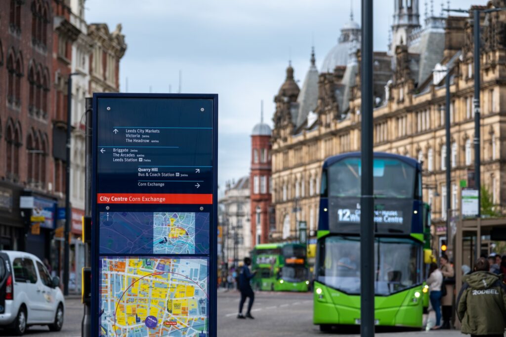 a bus is driving down a busy city street