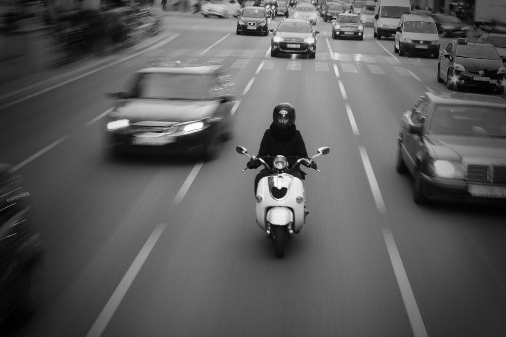 Person on Scooter on High Way